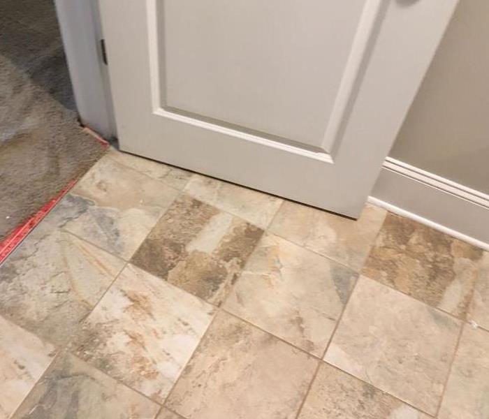 Bathroom baseboard that is affected with water damage