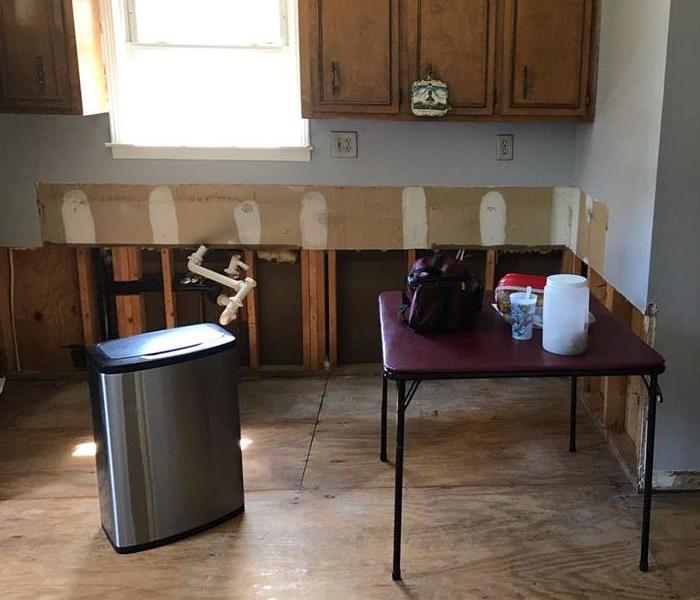 kitchen post water mitigation services and removed materials