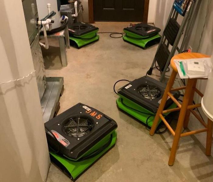 drying equipment placed on saturated carpet