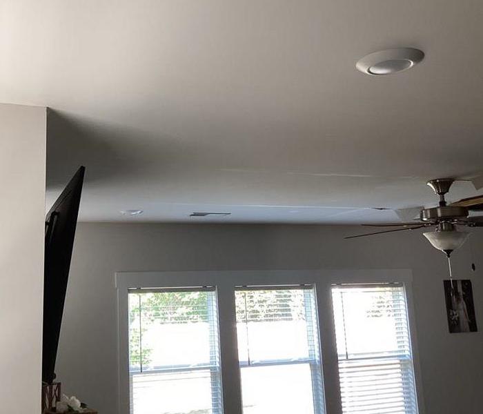 water damage to ceiling in family room 